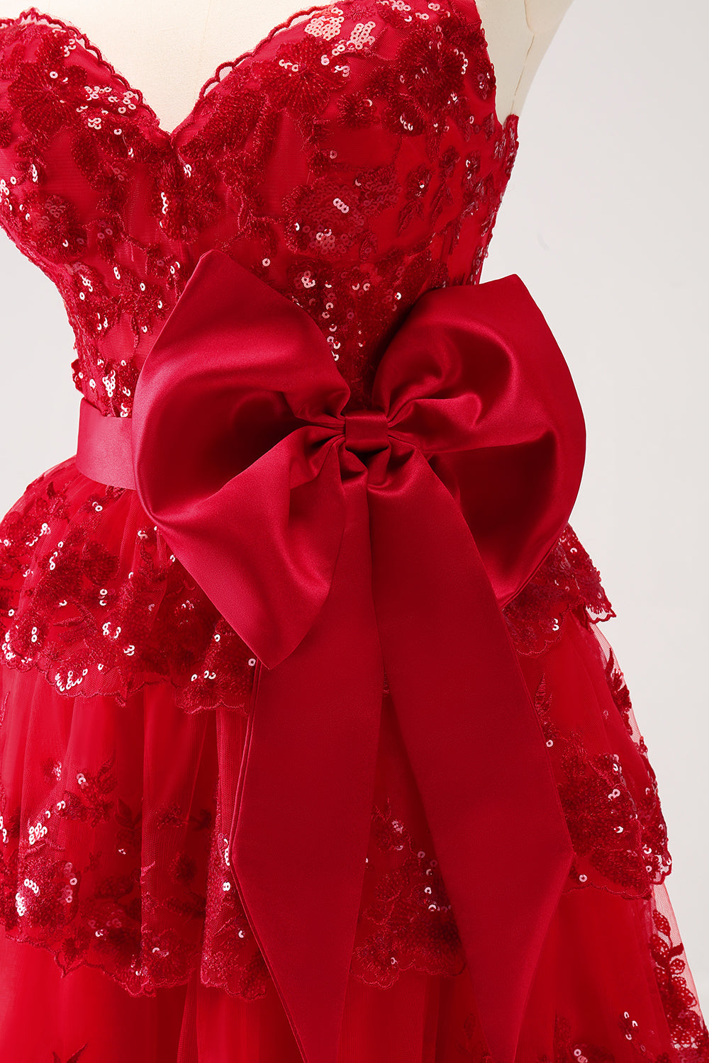 Luolandi Sparkly Red A Line Sweetheart Corset Tiered Ruffle Homecoming Dress with Bows Off Shoulder