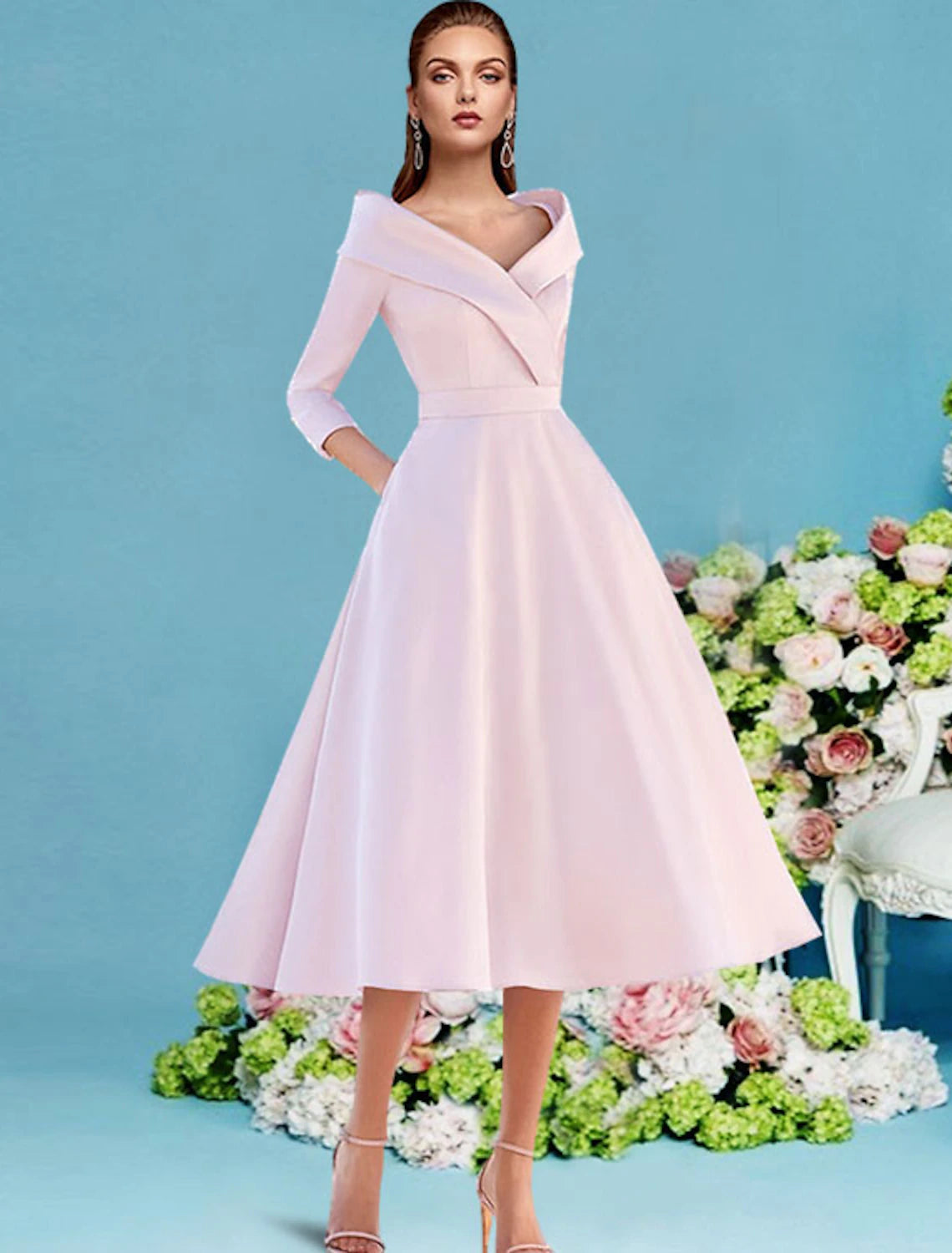 Woman wearing an elegant A-line V-neck tea-length satin dress with 3/4 sleeves.