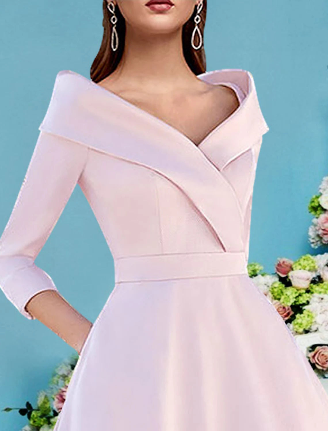 Close-up of the V-neck and 3/4 sleeves of the satin A-line dress.