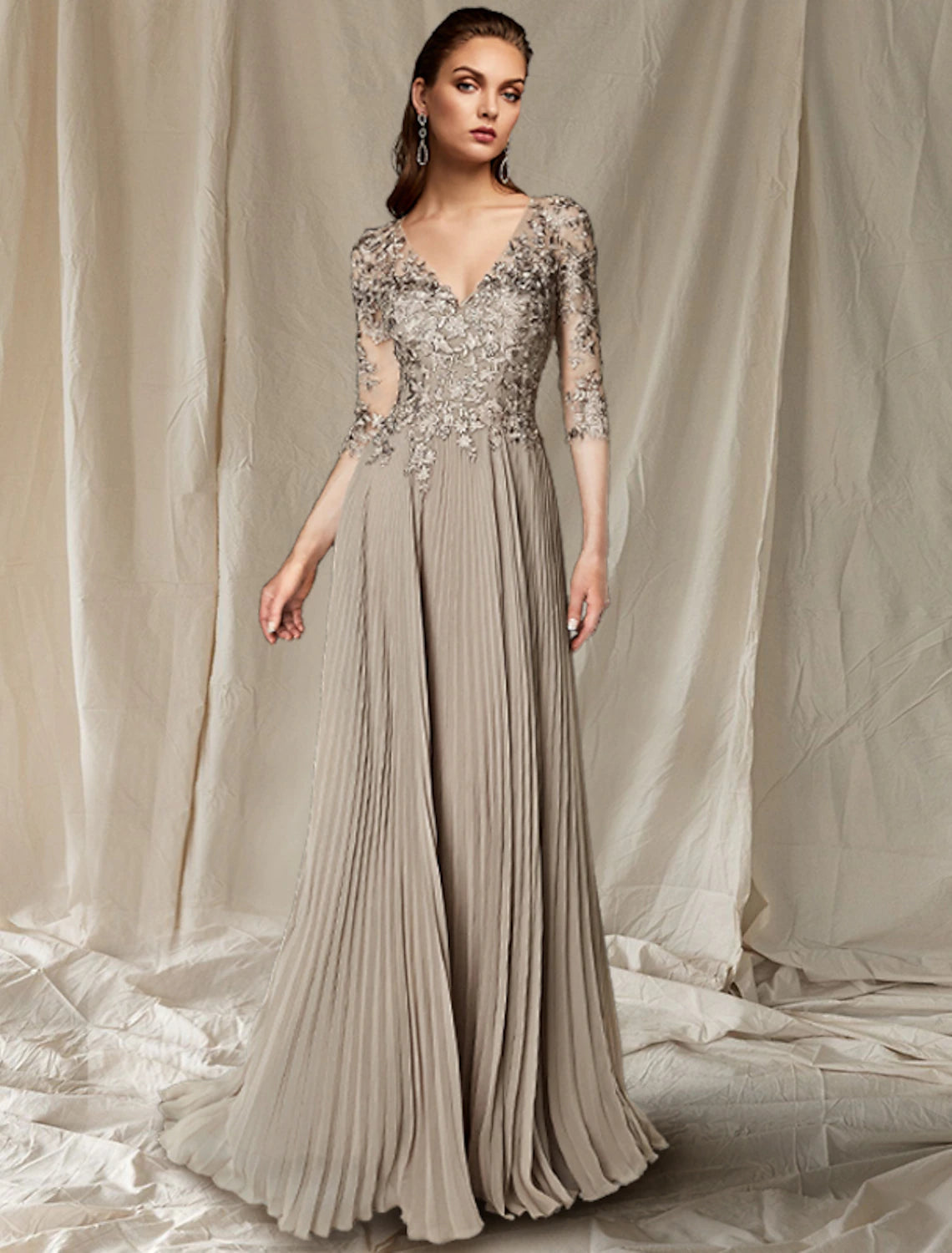 Elegant A-line mother of the bride dress with V-neck and half sleeves.