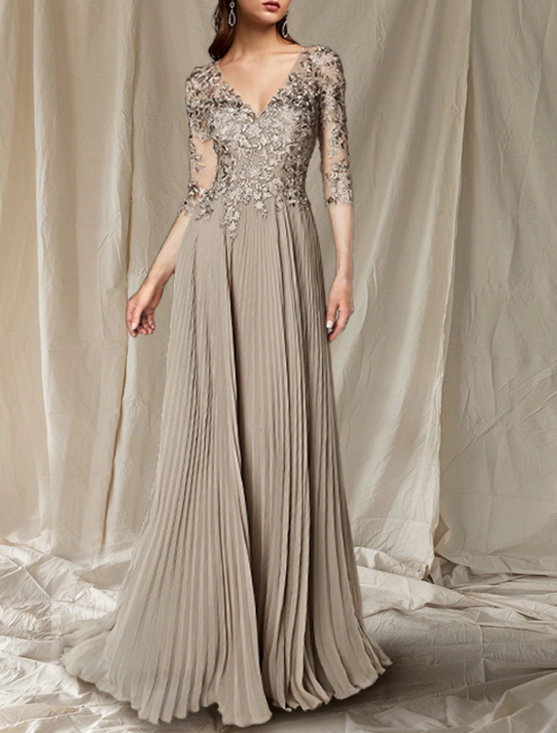 Side profile of the floor-length elegant wedding guest gown.