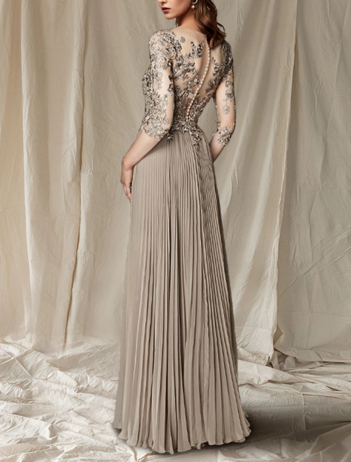 Close-up of the lace detail on the half sleeve of the dress.