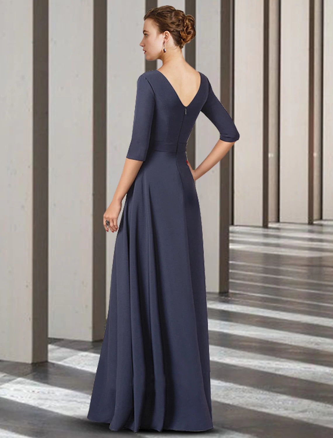 Back view of the floor-length Mother of the Bride gown featuring delicate bow details.