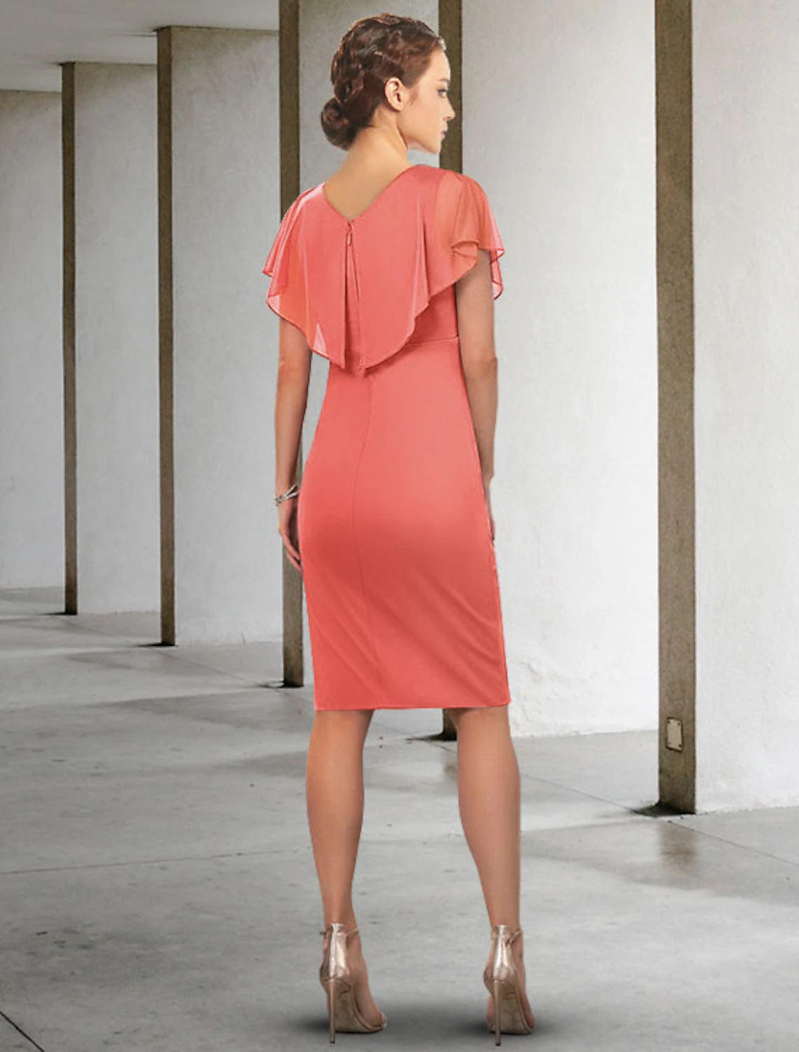 Side view of the blue knee-length chiffon dress with short sleeves.