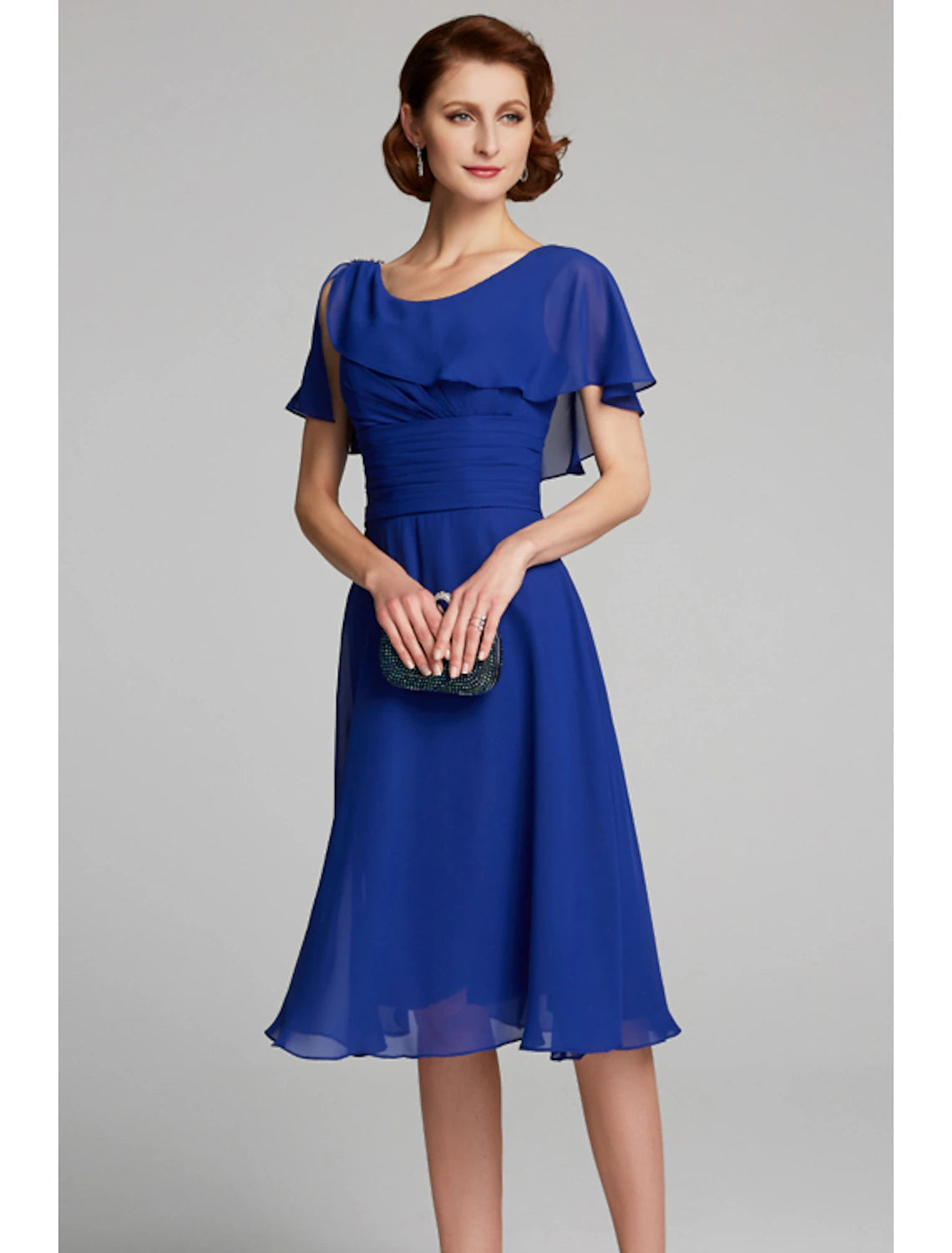Back view of the elegant A-line chiffon dress, highlighting the short sleeves and flowing fabric.