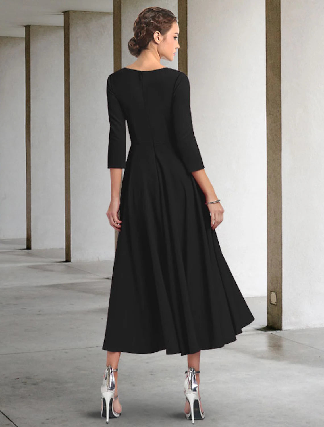 Back view of the elegant A-Line Mother of the Bride dress, showcasing the V-neck, 3/4 sleeves, and flowing tea length.