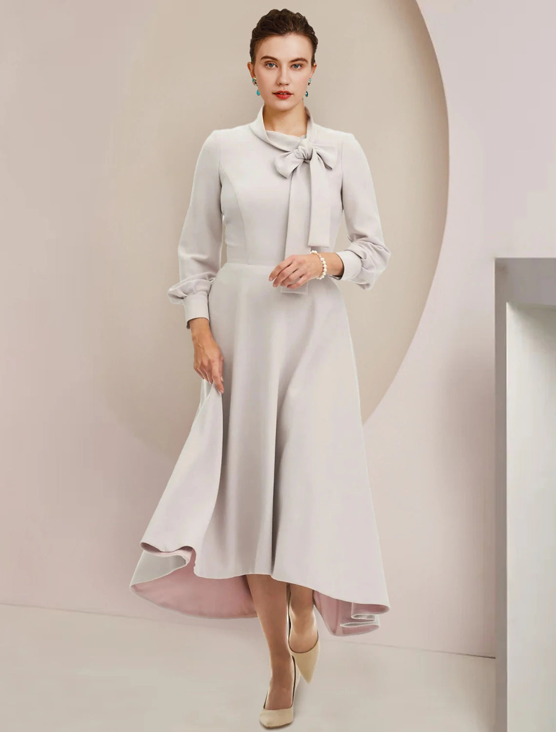 Elegant A-line Mother of the Bride dress with high neck and long sleeves.
