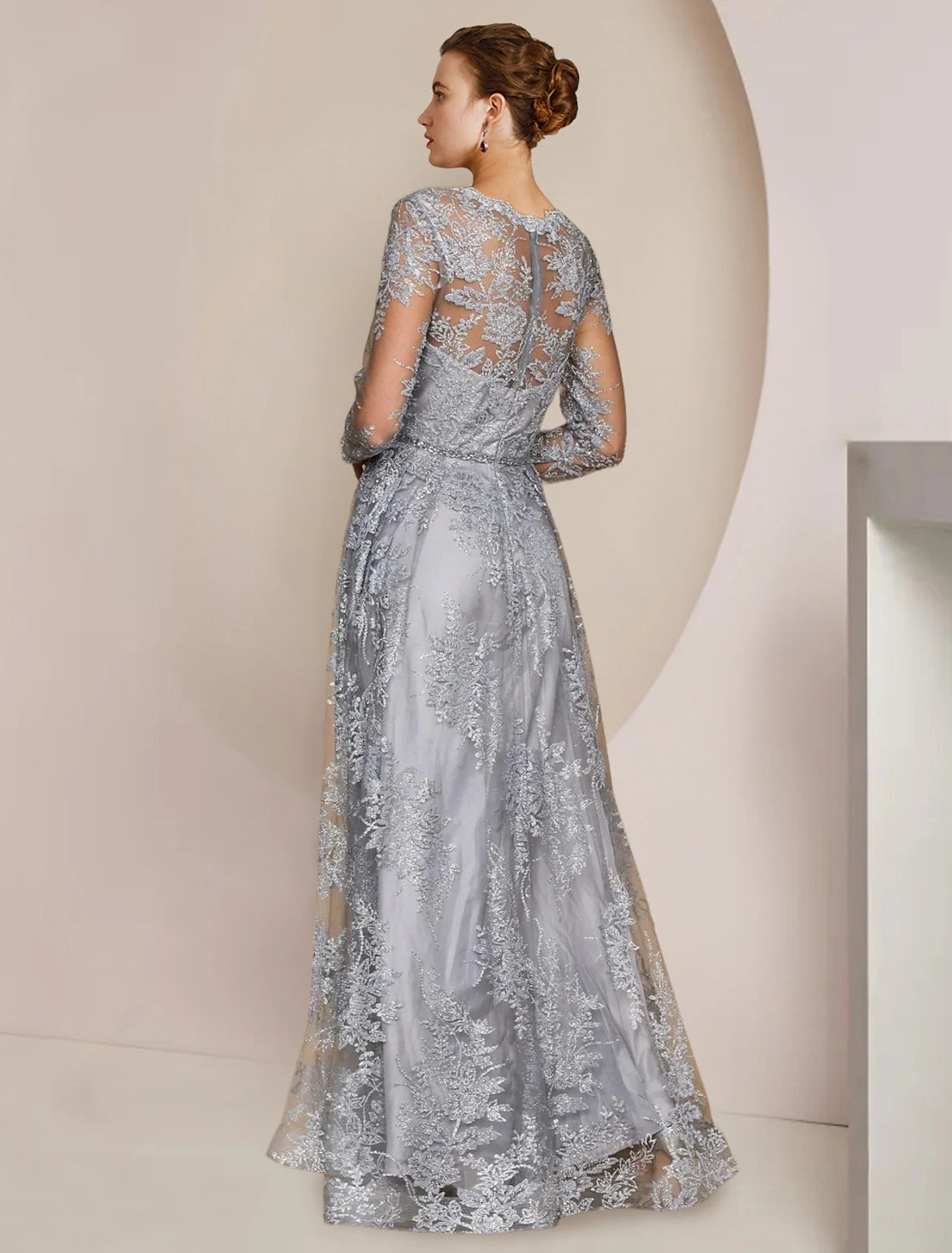 Formal A-Line wedding guest gown, showcasing intricate lace and sparkling appliques.