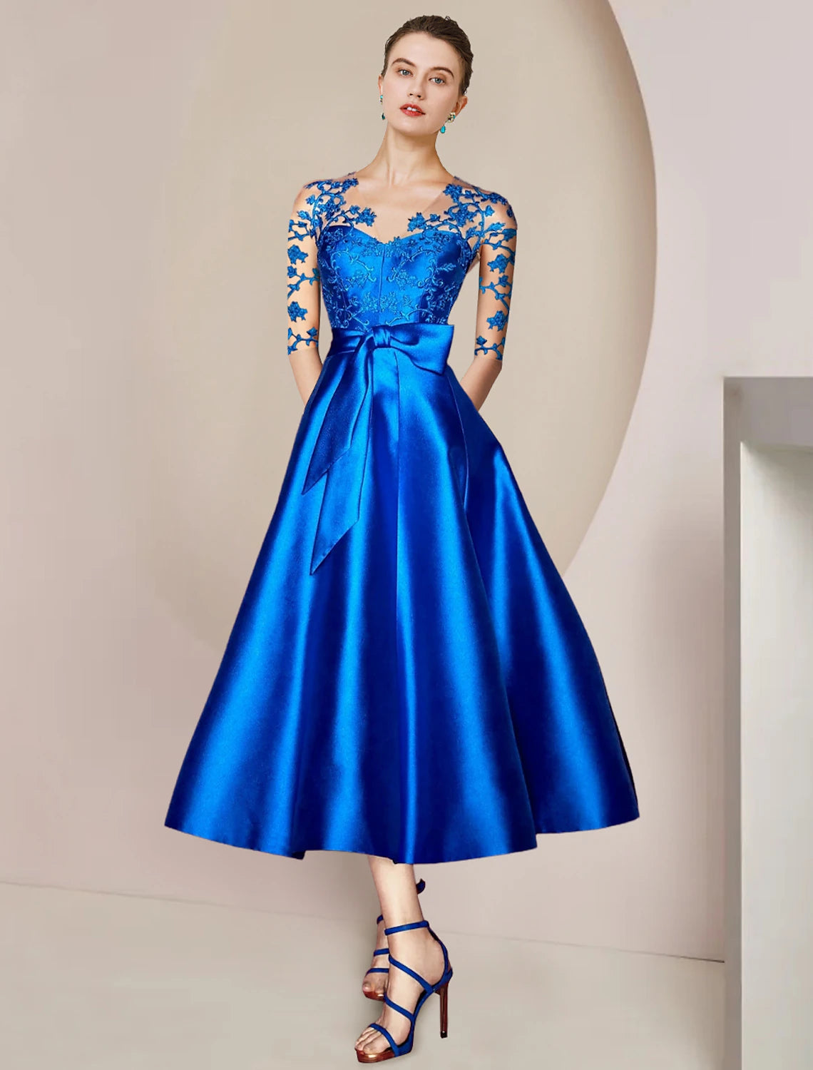 Elegant A-line Mother of the Bride dress in satin and lace with V-neck and half sleeves, front view.