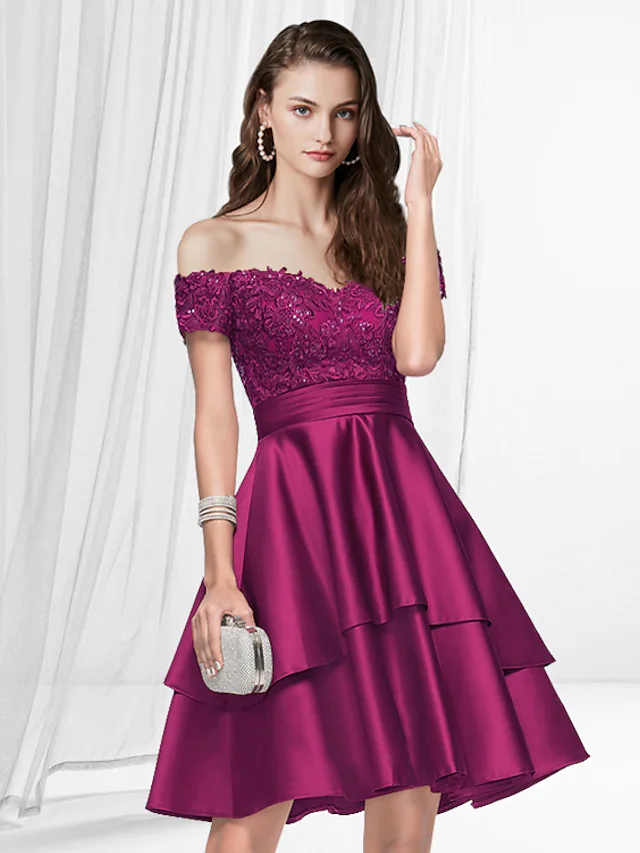 Model wearing a Luolandi A-line off-shoulder satin homecoming dress with pleats, knee-length.