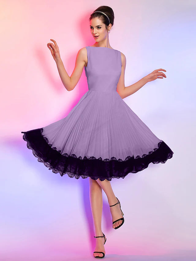 Model in a pink A-line knee-length cocktail dress with boat neck and sleeveless design.
