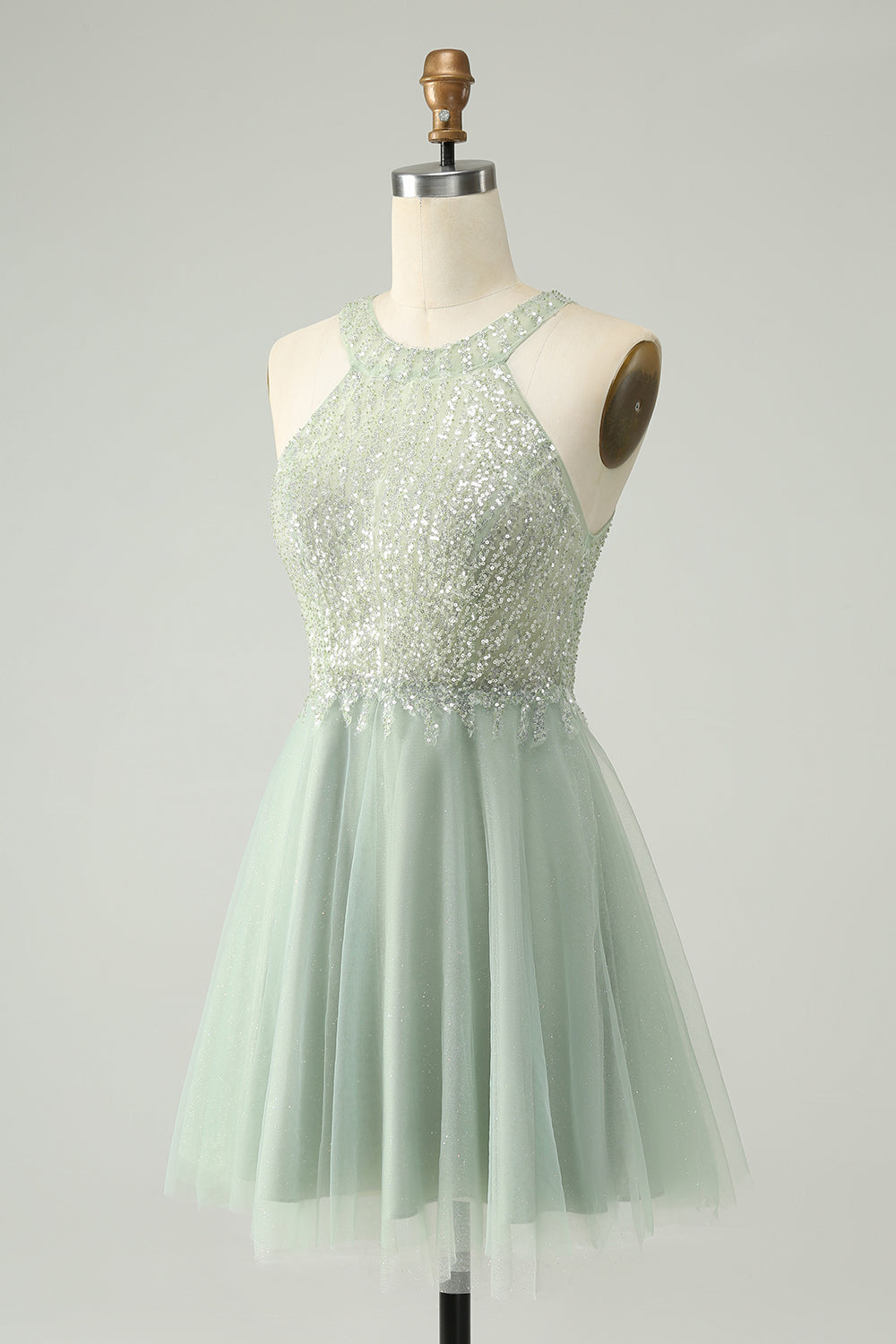 Side profile of the dusty green A-line halter short homecoming dress, highlighting the silhouette.