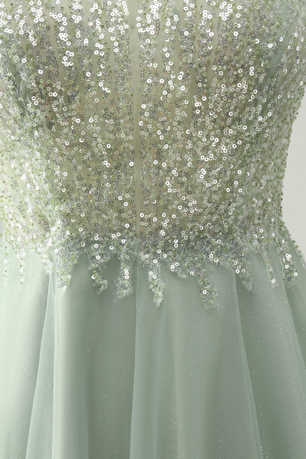 Full length view of the dusty green A-line halter short homecoming dress, worn by a model.