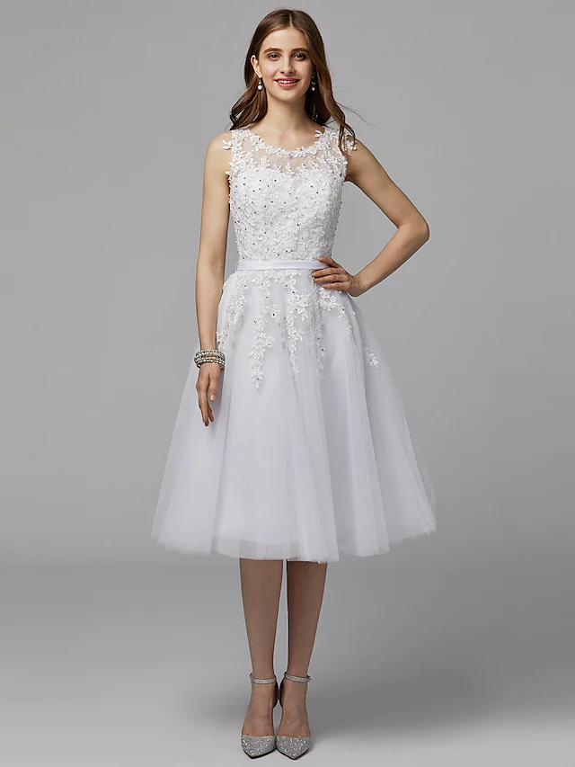 Back view of the A-line floral lace dress, highlighting the tea length and elegant silhouette.