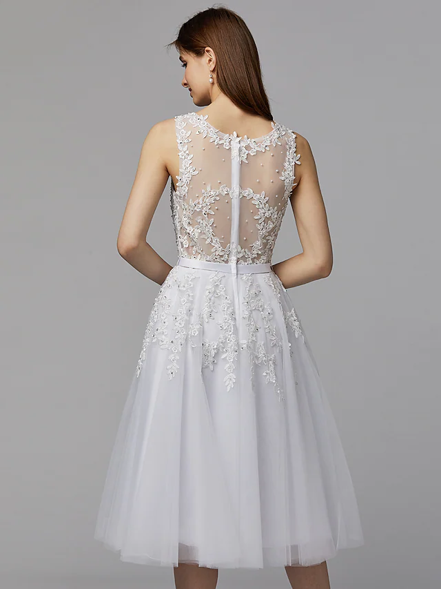 Full view of the woman in the A-line floral lace dress, showcasing its graceful movement.