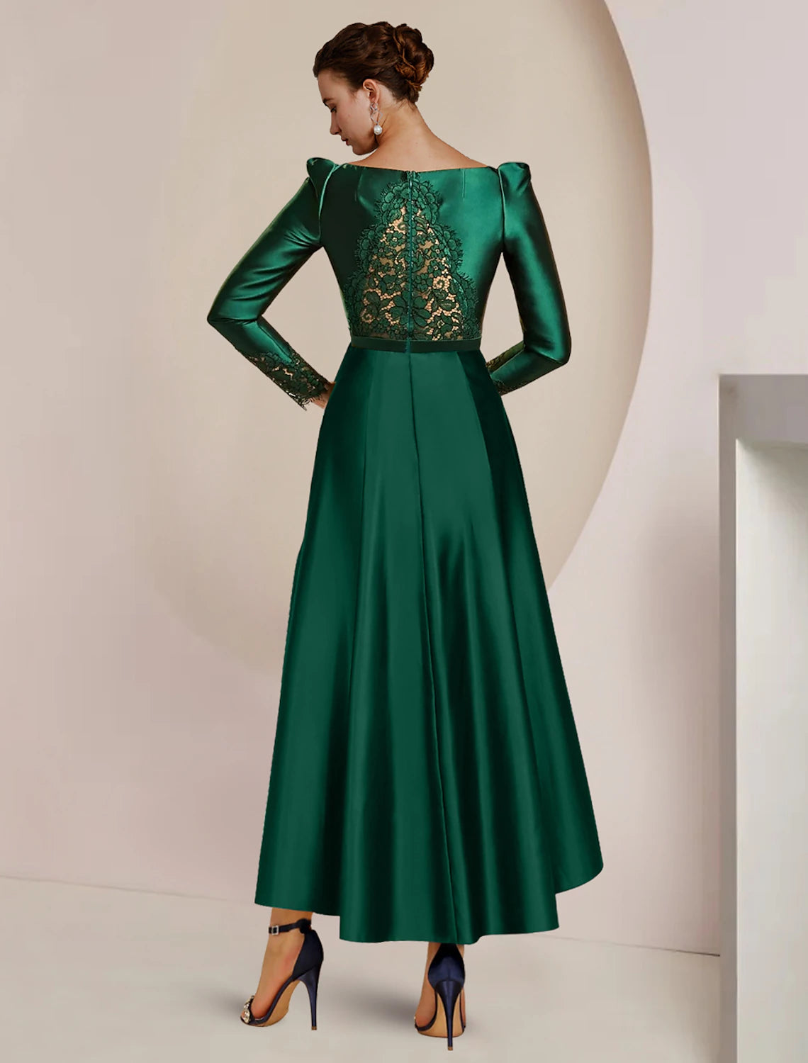 Back view of the satin and lace A-line dress, showing the scoop neck and pleats.