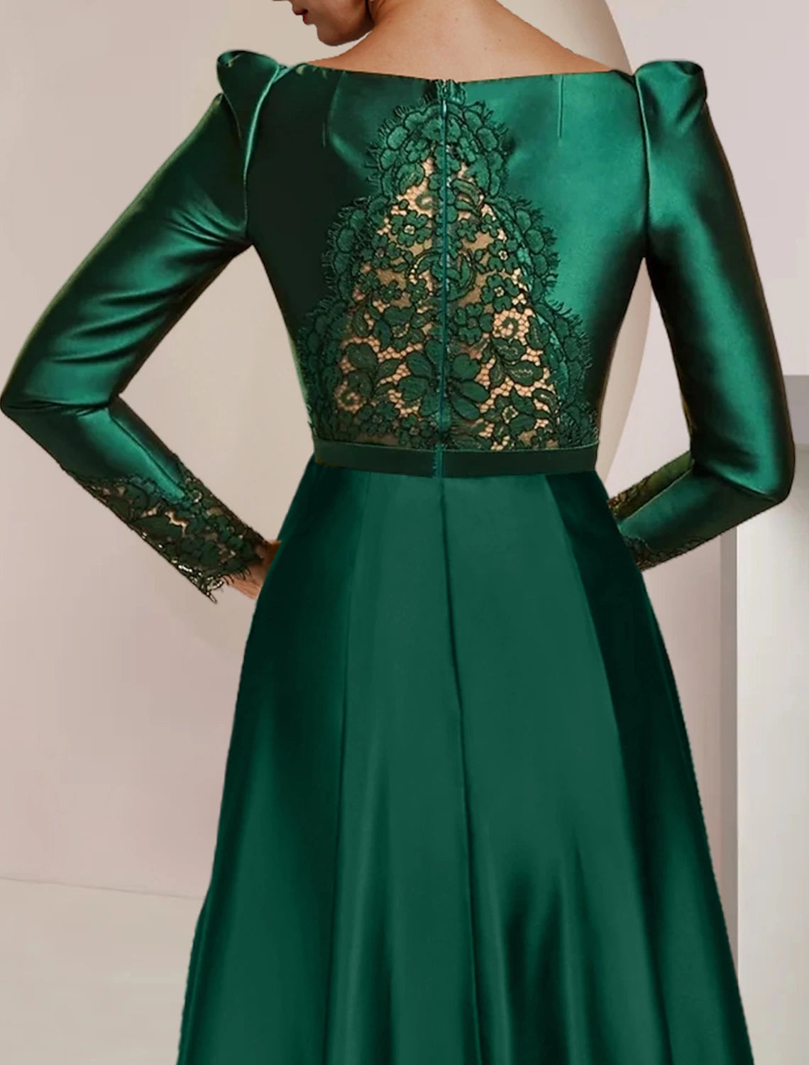 Close-up of the satin and lace fabric on the long-sleeved A-line dress.
