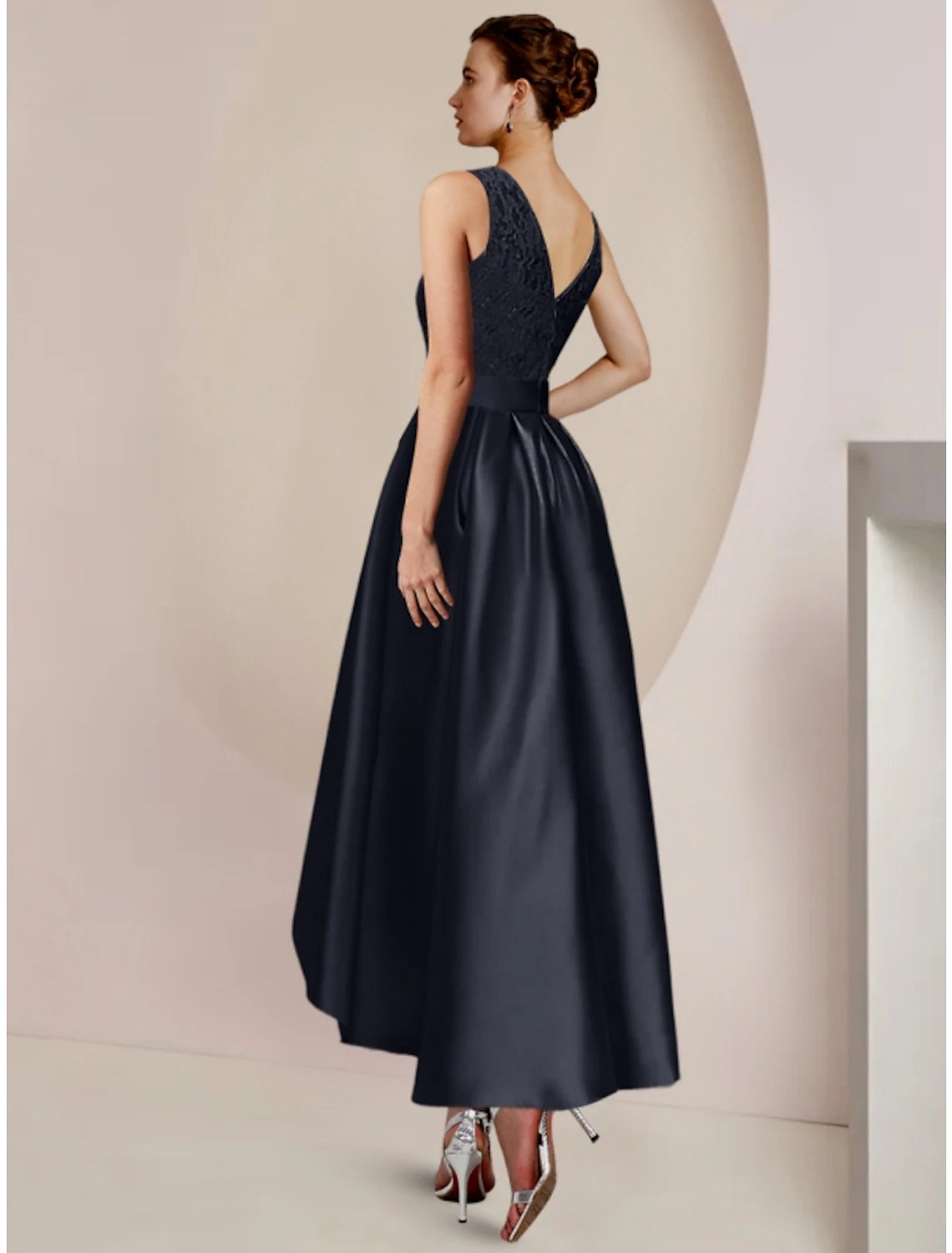 Detail shot of the Luolandi wedding guest dress, focusing on the lace sleeves and scoop neckline.