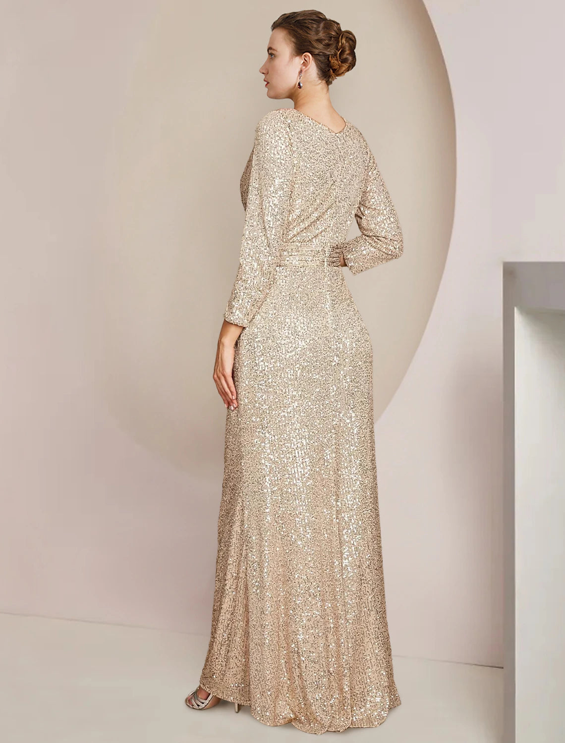 Back view of the floor-length sequined formal gown, showcasing its elegant silhouette.