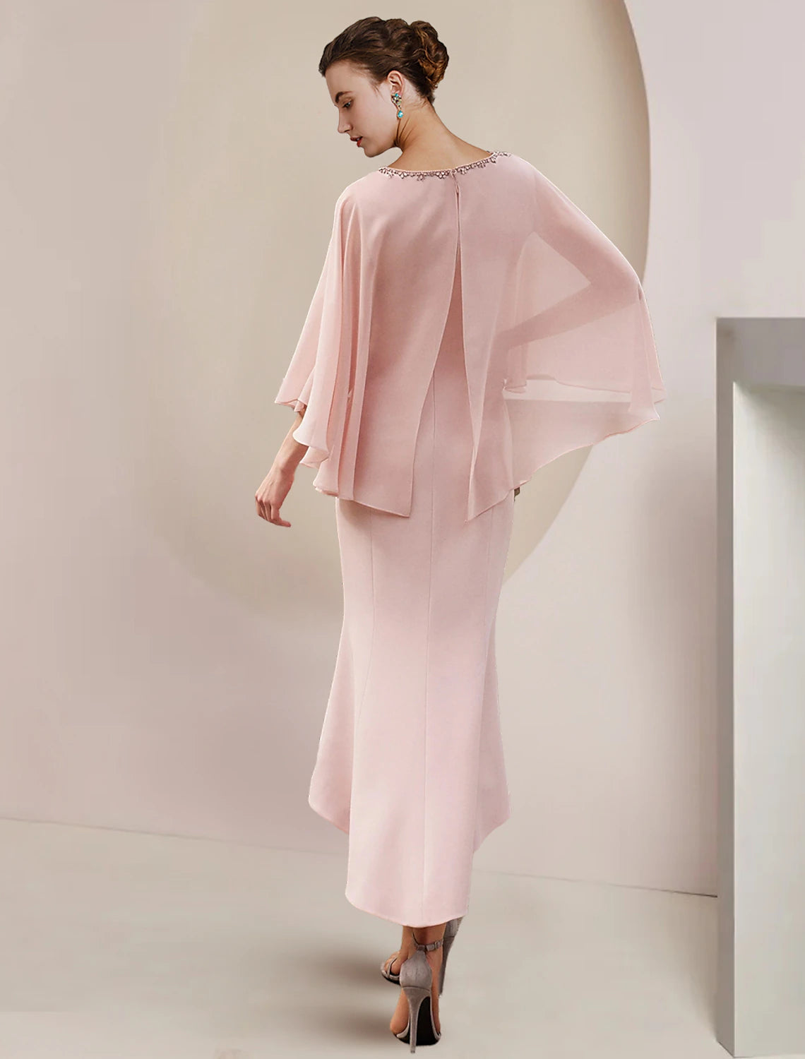 Back view of the tea-length chiffon mother of the bride gown.