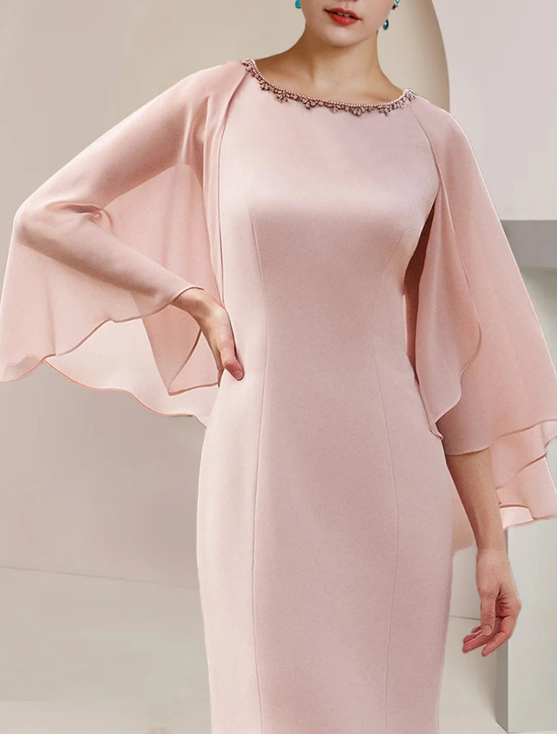 Side view of the sleeveless formal wedding guest dress.
