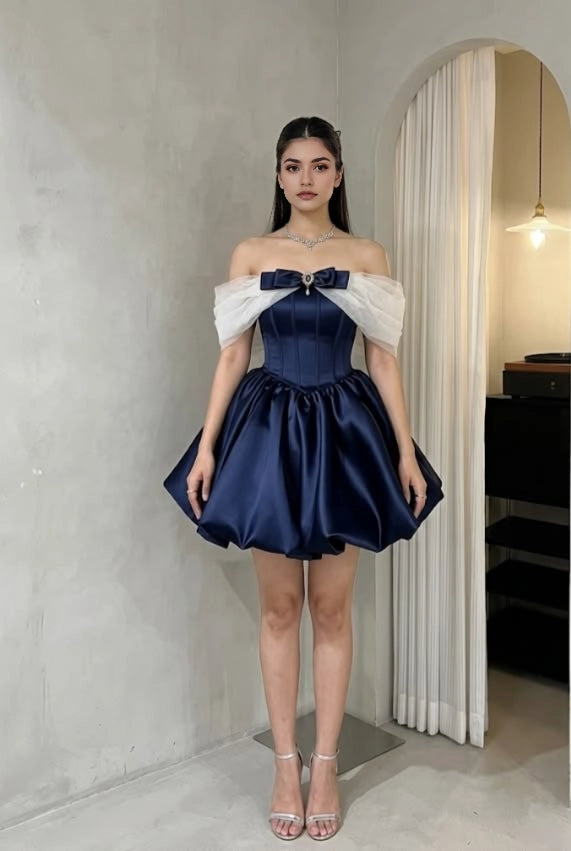 Model wearing a blue off-shoulder A-line short dress, suitable for homecoming.