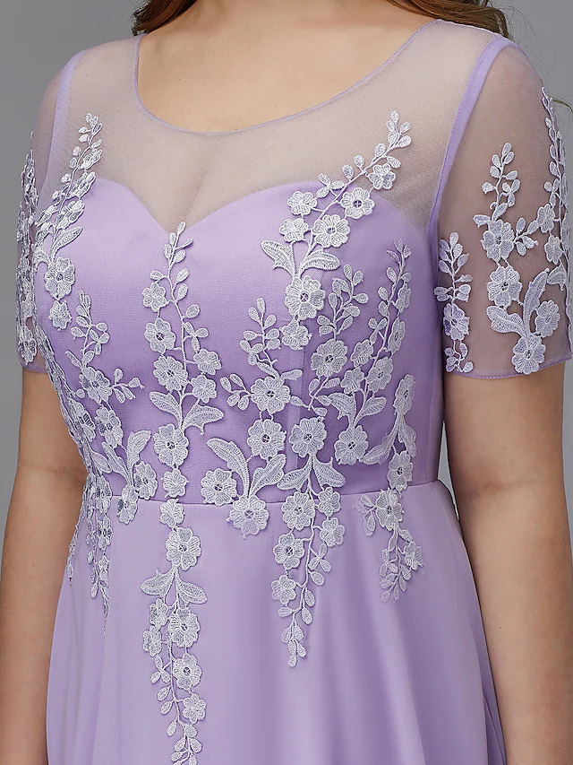 Model posing in the knee-length A-line plus size chiffon lace dress.
