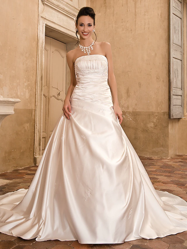 Luolandi Princess A-Line wedding dress, strapless satin gown, side view.