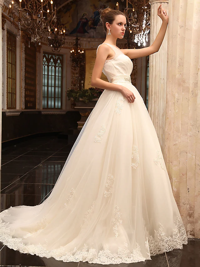 Side view of a satin and tulle A-line wedding gown.