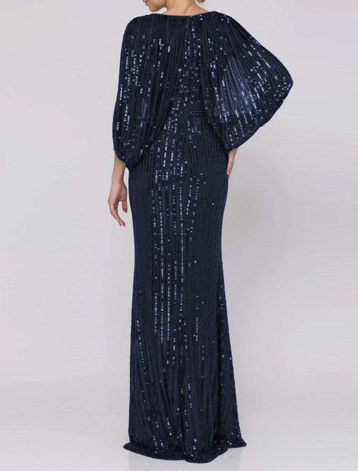 Side view of the sparkling mermaid trumpet gown, highlighting the elegant silhouette and leg slit.
