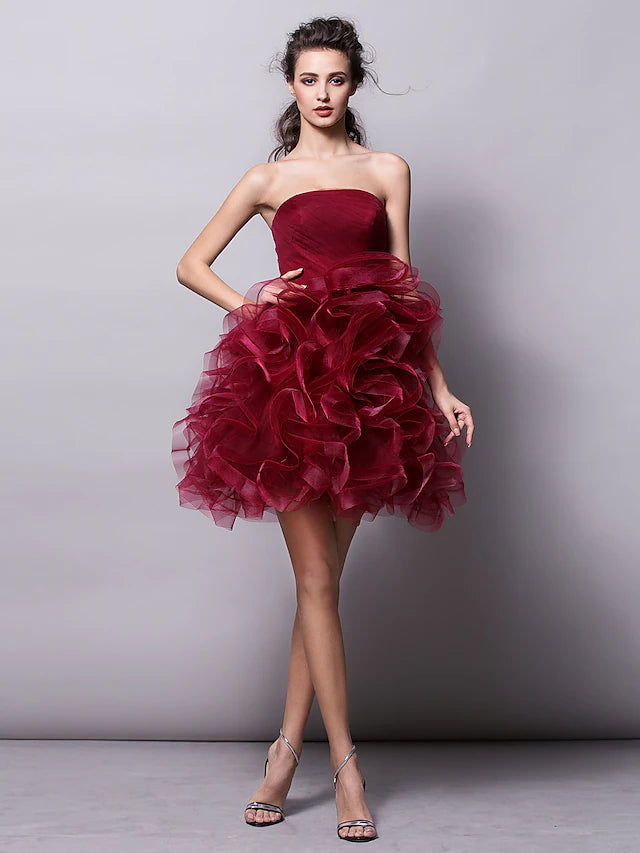 Luolandi strapless tulle ball gown with ruched tier detail.
