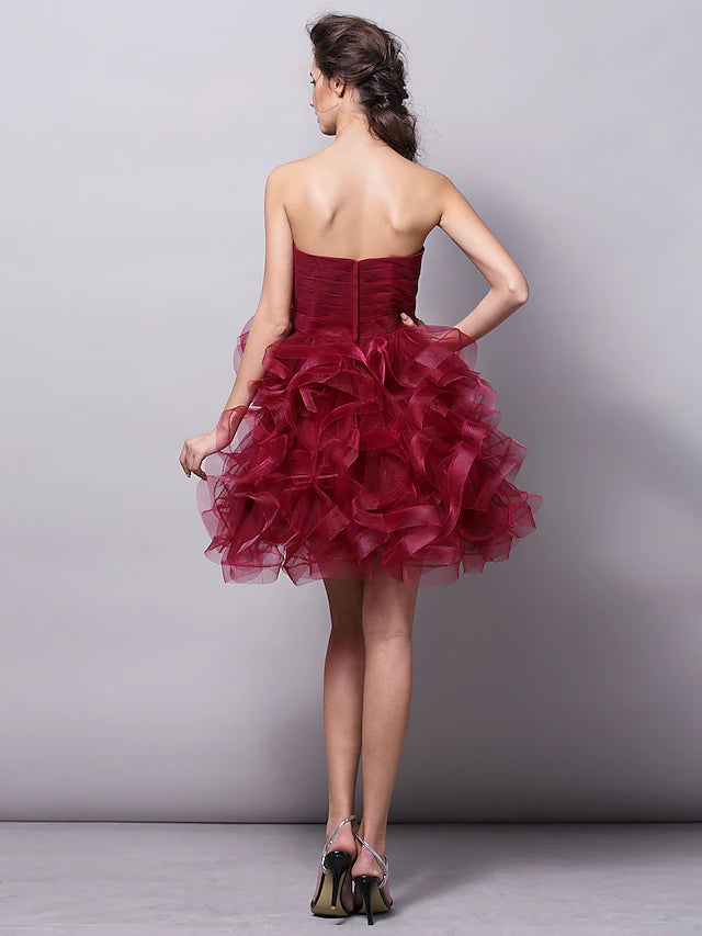Side view of strapless homecoming dress, highlighting tulle fabric.