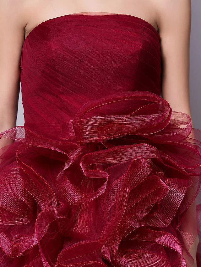 Model wearing Luolandi short ball gown, showcasing movement.