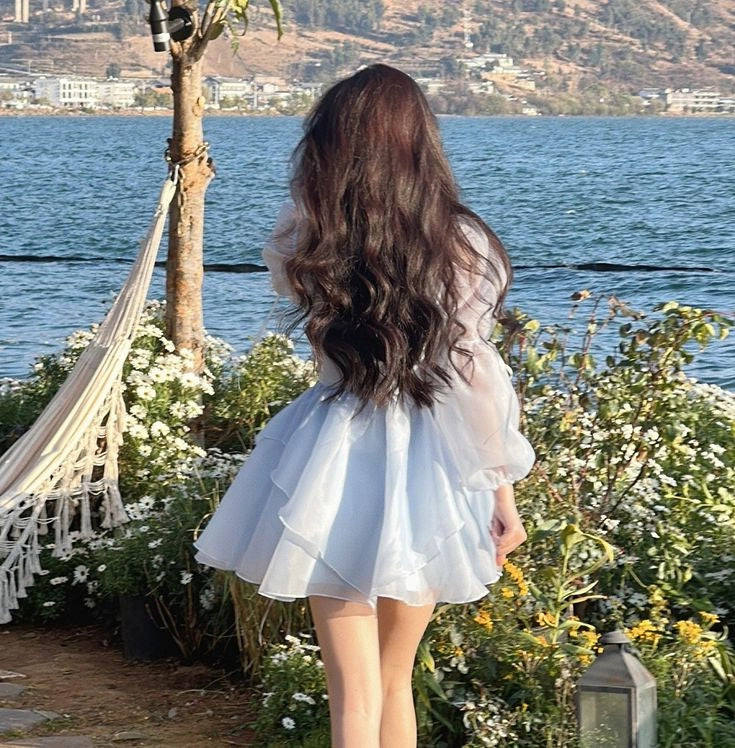 Side view of the A-line short dress with long sleeves.