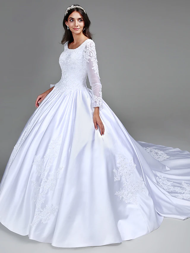 Close-up of the beaded long sleeve and scoop neckline on the Luolandi wedding dress.