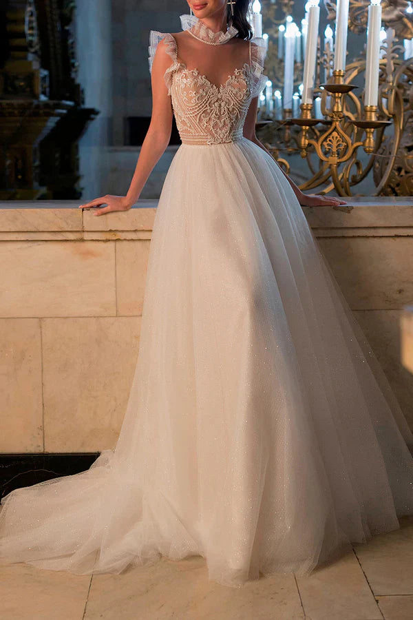 Luolandi A bohemian wedding dress with a thread illusion and sparkling beads at the neckline Beautiful