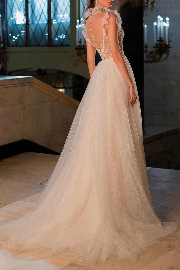 Luolandi A bohemian wedding dress with a thread illusion and sparkling beads at the neckline Beautiful