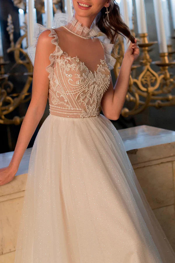 Luolandi A bohemian wedding dress with a thread illusion and sparkling beads at the neckline Beautiful