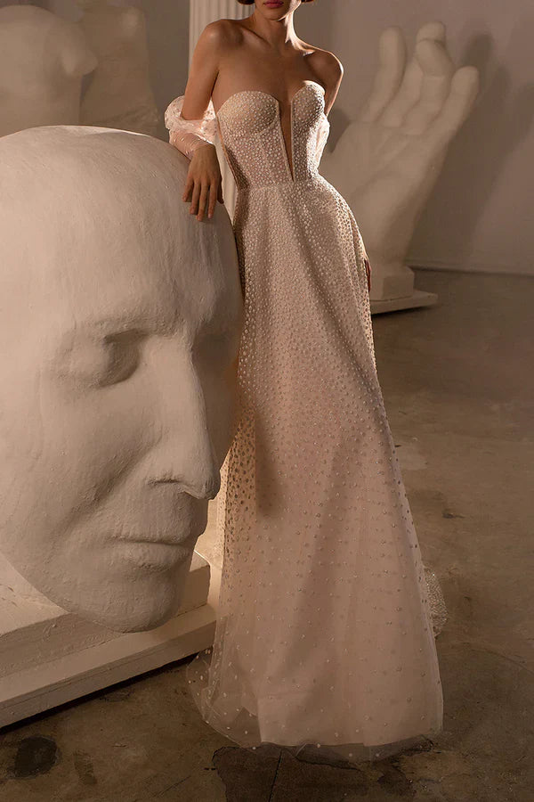 Luolandi A charming deep V-neck bohemian beach wedding dress paired with a court train Beautiful